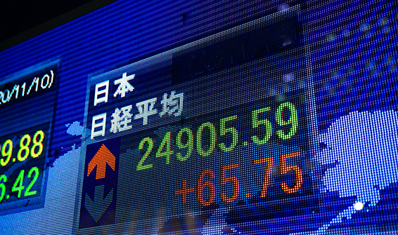 A Electric bulletin board at the business town in Yaezu Tokyo at night closeup. Chuo district Yaezu Tokyo Japan - 11.10.2020 : Translation on neonboard text Japanese Kanji charactor.